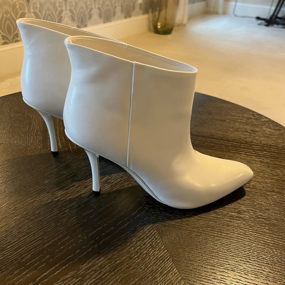 Like new snow white Calvin Klein booties. No marks or scars. Worn twice.